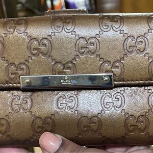 Gucci Embossed Brown Leather Clutch